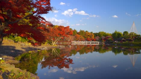 Slow-panning-shot-across-beautiful-scenery-inside-Japanese-landscape-garden-during-fall