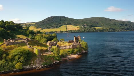 Scottish-Castle-Splendor:-Aerial-Scenery-of-Urquhart-Castle-on-the-Mystical-Loch-Ness-in-Scottish-Highlands,-Scotland,-United-Kingdom
