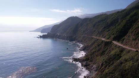 Aerial-drone-shot-flying-up-Highway-1-on-the-Pacific-Coast-near-Big-Sur,-California