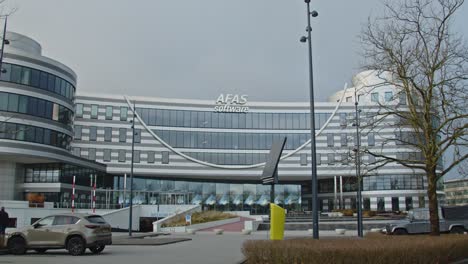 Wide-tilt-down-of-AFAS-headquarter-in-Leusden,-the-Netherlands