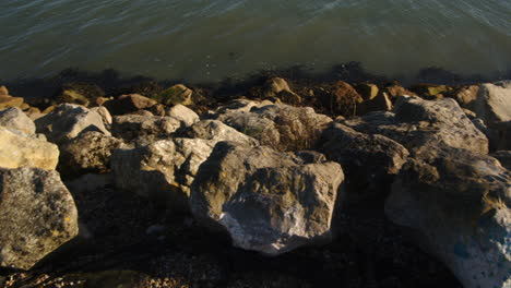 Planning-shot-of-sea-lapping-on-rocks-at-Hythe-Marina