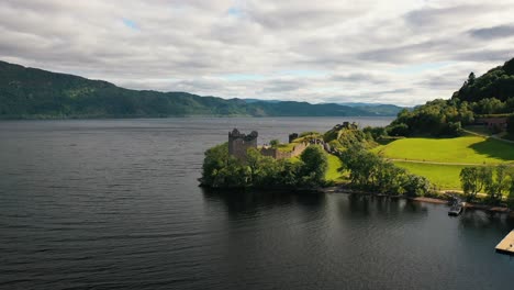 Lochside-Sentinel:-The-Storied-Walls-of-Urquhart-Castle,-Aerial-Views-from-Loch-Ness-in-the-Scottish-Highlands