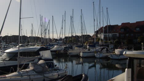 Extra-wide-shot-of-Hythe-Marina-village-with-sun-in-background