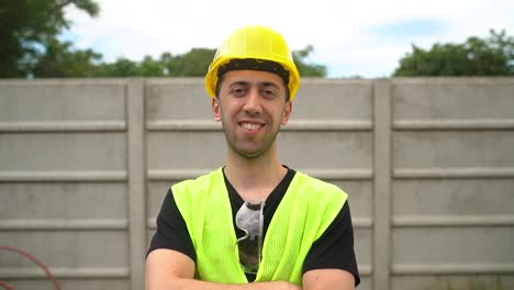 A-Construction-Worker-Wearing-a-Yellow-Hard-Hat-Appears-Content-with-the-Outcome-of-His-Labor---Medium-Close-Up