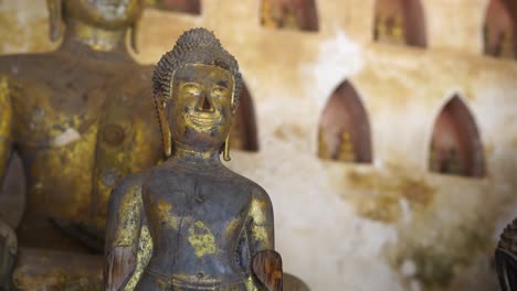 Partial-Bronze-And-Gold-Plated-Buddha-Statues-Located-At-Wat-Si-Saket-In-Vientianne,-Laos