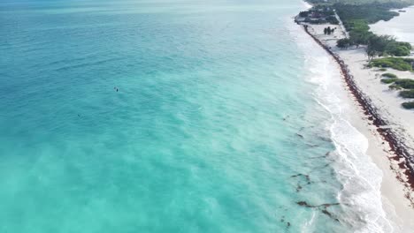 Aerial-above-the-azure-and-turquoise-blue-waters-of-Isla-Blanca,-Cancun,-Mexico