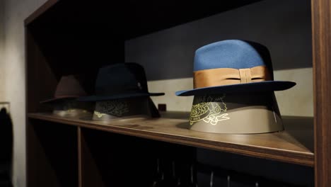 Tailor-shop-showcase-elegant-custom-made-hats-in-open-style-closet-shelf