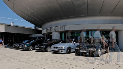 Vintage-BMW-car-meeting-at-museum-in-Munich-for-50-years-celebration,-time-lapse