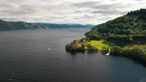 Aerial-Highlands-Tapestry:-Urquhart-Castle-Amidst-the-Lush-Greens-of-Scotland-on-Loch-Ness,-Inverness