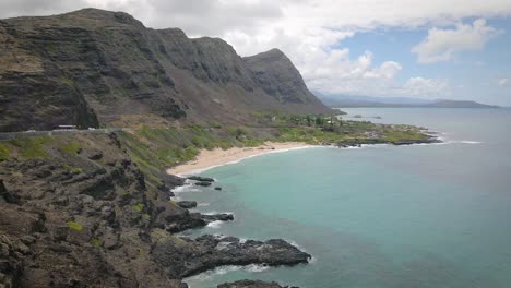 A-stone-sand-tropical-beach-in-Hawaii-is-the-epitome-of-natural-beauty-with-its-radiant-turquoise-sea