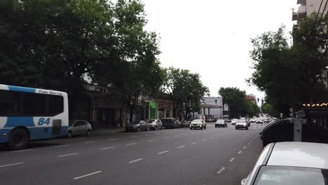 Flow-of-Traffic-Cars-Bus-Public-Transportation-of-Buenos-Aires-City-Drive-Avenue-Gaona-in-Caballito-Neighborhood,-Daylight