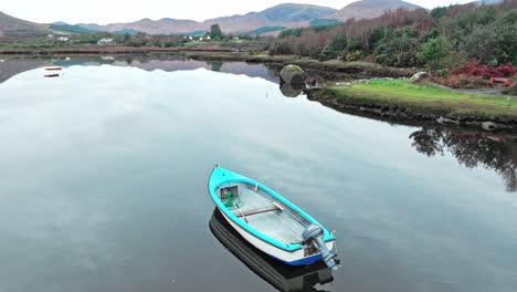 Deone-Ring-Of-Kerry-boat-on-still-waters-in-Sneem-on-the-ring-of-Kerry-on-a-calm-autumn-morning