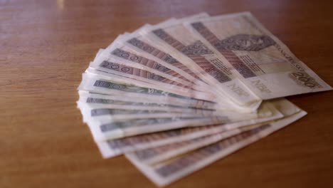 money-lying-on-the-table,-a-large-amount-of-Polish-cash,-200-PLN