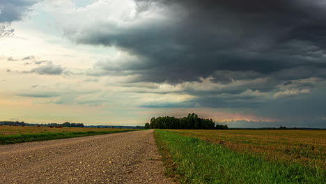 A-Time-Lapse-Shot-Of-A-Wind-Shear-And-A-Landscape-With-A-Road-That-Leads-To-The-Forest