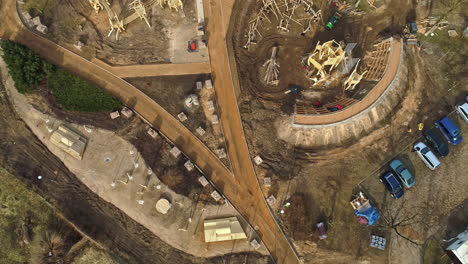 An-Aerial-Shot-Of-An-Building-Construction-Taking-Place-With-Construction-Vehicles