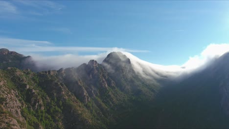 Majestic-view-of-Sant-Salvador-de-les-Espases,-cliff-shrouded-in-fog