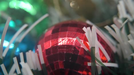Christmas-decoration,-colorful-crystal-ornaments-golden,-blue,-green-and-red-balls,-new-year-decorated,-shiny-lights,-cinematic-close-up-Macro-tilt-up-4K-video,-beautiful-depth-of-field,-bokeh-light