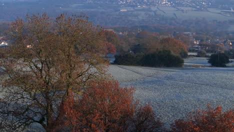 Establishing-Aerial-Drone-Shot-of-Frosty-Fields-with-Calverley-Village-in-Background-Leeds-West-Yorkshire-UK