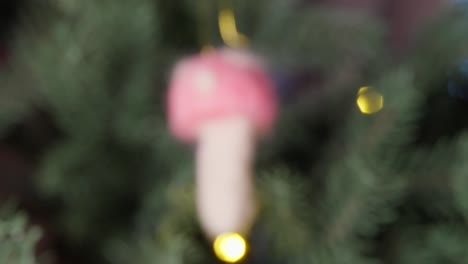Cute-hand-crafted-mushroom-christmas-tree-decoration,-focus-pull-handheld