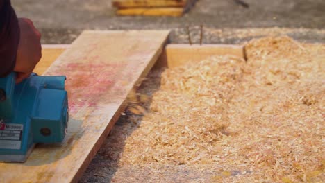 Carpenter-working-on-smoothing-wood