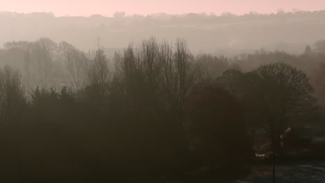 Aerial-Drone-Shot-with-Long-Lens-of-Winter-Trees-on-Misty-Morning-at-Sunrise-7x-Lens