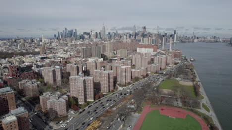 Aerial-View-Of-Sports-Field-With-Quarter-mile-running-track-Beside-The-East-River-And-FDR-Drive-In-Brooklyn