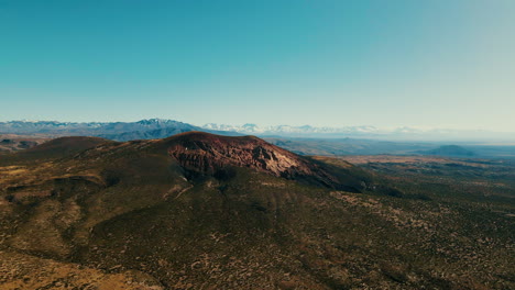 Panoramic-image-of-Volcan-Malacara-in-Malargüe,-with-the-imposing-Andes-mountain-range-in-the-background
