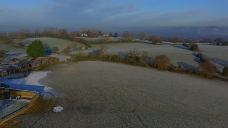 Establishing-Aerial-Drone-Shot-on-Frosty-Morning-Over-Horse-Fields-in-West-Yorkshire-UK