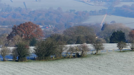 Establishing-Aerial-Drone-Shot-7x-Panning-Up-to-Look-Across-The-Valley-From-Calverley-towards-Horsforth-and-Rawdon-on-Frosty-Morning-UK