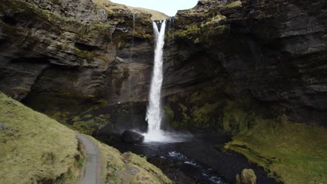 Mystical-waterfall-Kvernufoss-in-Iceland,-aerial-forward,-no-people