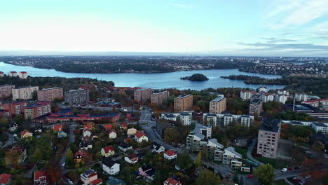 Aerial-drone-shot-flying-high-over-Stockholm-suburb-buildings-in-Sweden-during-evening-time