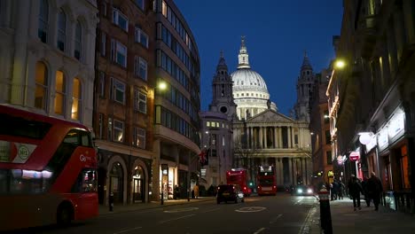 Red-London-Buses-Driving-Towards-St-Paul's-Cathedrals,-London,-United-Kingdom