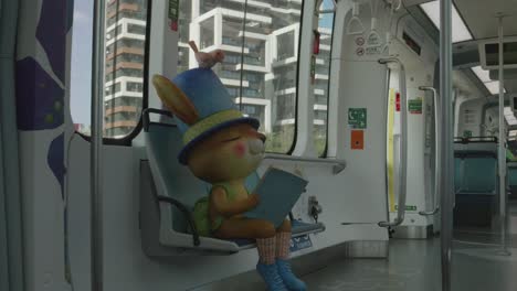 Rabbit-Mascot-In-A-Danhai-Light-Rail-Train-Car,-Taipei