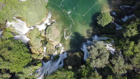 Picturesque-waterfall-Kravica,-Bosnia-and-Herzegovina,-aerial-top-down-lowering