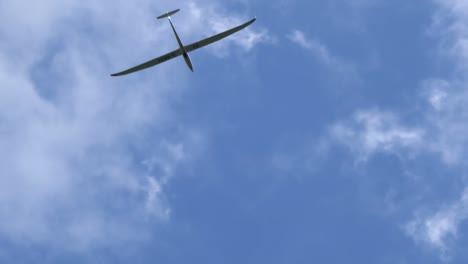 Motor-plane-and-glider-plane-spotted-flying-in-the-sky-on-clear-bright-day