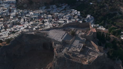 Dolly-back-pan-up-aerial-shot-of-the-Lindos-Acropolis