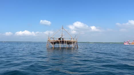 Medium-shot-of-the-Bagan-structure-in-the-ocean-used-for-night-fishing-in-the-Indian-Ocean-near-Muncar-village,-East-Jawa,-Indonesia