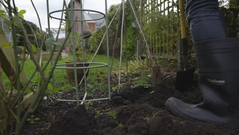 Digging-up-soil-in-garden