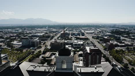 Orbiting-drone-shot-of-the-American-flag-waving-over-Utah