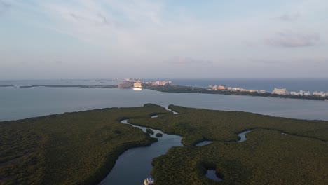 High-altitude-aerial-of-the-landscape-near-Punta-Nizuc-bridge-in-Cancun-Mexico-with-a-view-over-the-blue-waters-of-the-Caribbean-Sea