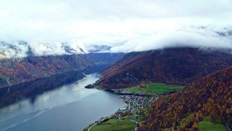 Aerial-nature-view-mountains-village-near-fjord-lake-in-Norway