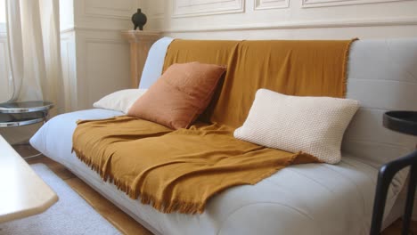 Dolly-shot-of-a-modern-sofa-in-a-French-style-setting