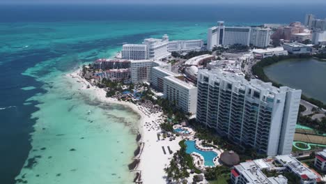 Aerial-view-of-Cancun-luxury-hotel-zone-with-blue-Caribbean-sea-and-white-beach,-Mexico