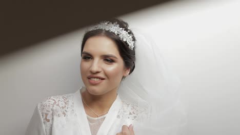 Beautiful-and-lovely-bride-in-night-gown-and-veil.-Wedding-morning.-Slow-motion