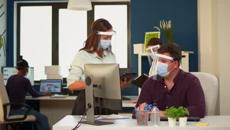 Businesspeople-crew-with-masks-working-at-new-startup-project