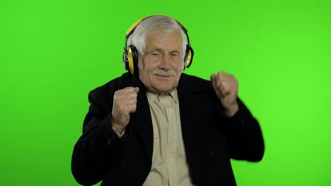 Elderly-caucasian-grandfather-man-dance,-celebrate,-listen-music.-Chroma-key