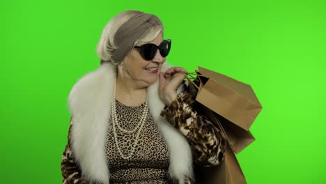 Elderly-stylish-grandmother.-Caucasian-woman-after-successful-online-shopping