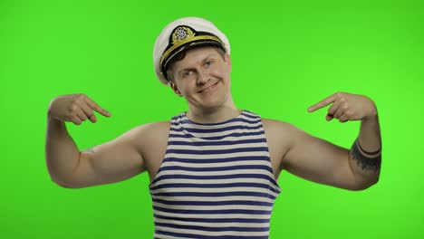 Young-sailor-man-pointing-oneself-with-fingers-proud-and-happy.-Seaman-guy