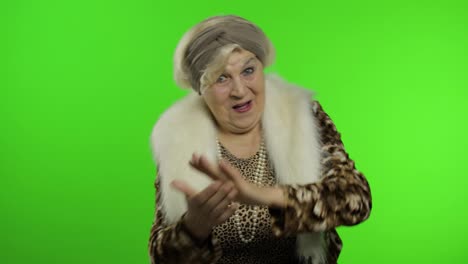 Elderly-stylish-grandmother.-Caucasian-woman-claps-her-hands.-Chroma-key