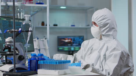 Woman-scientist-working-at-vaccine-development-typing-on-pc